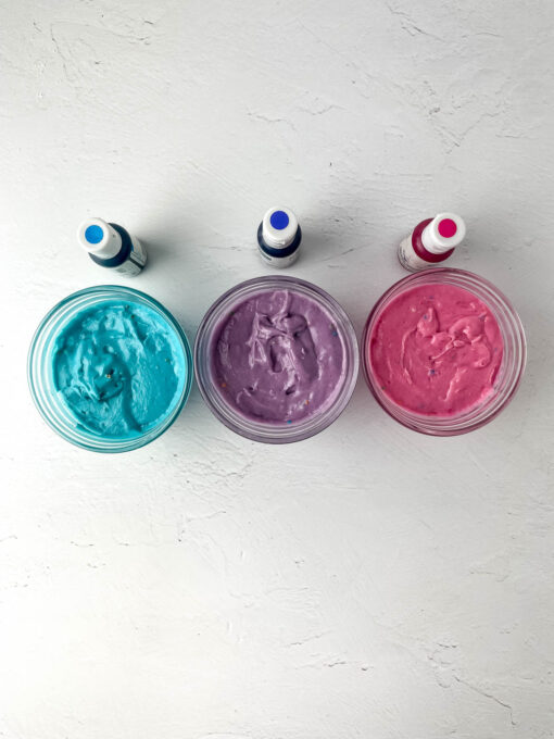 Marshmallow fluff mixture colored purple, blue and pink