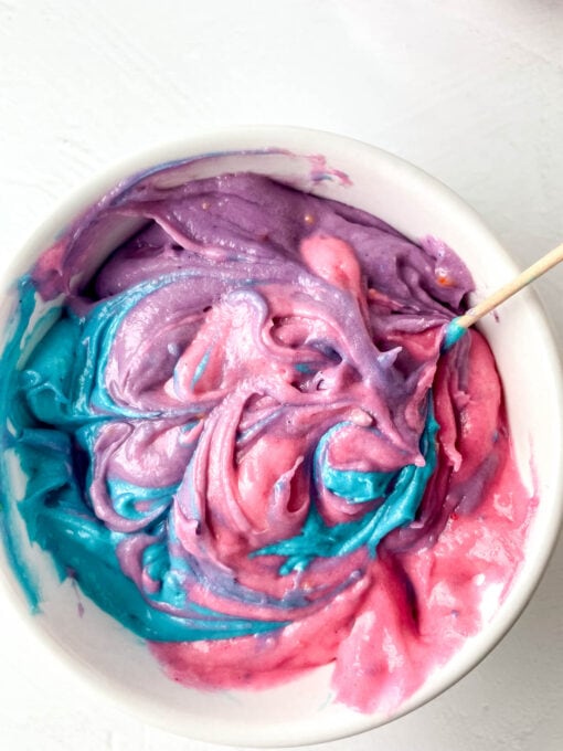 Swirling colored dips together with a toothpick