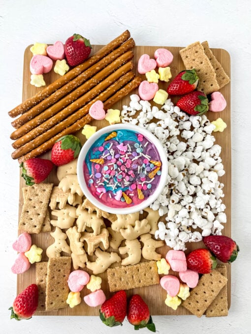 Marshmallows, strawberries, graham crackers and more on charcuterie board