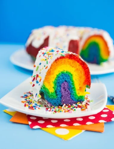 Rainbow bundt cake with white frosting