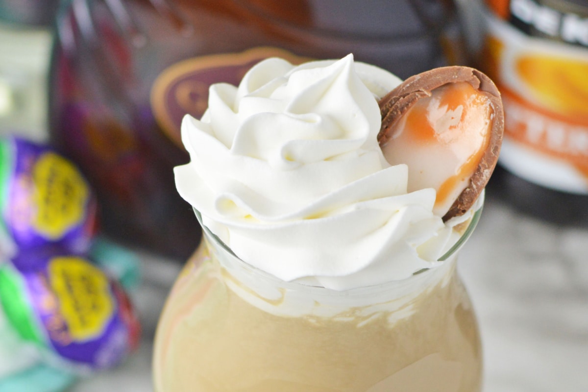Whipped cream and half a Cadbury cream egg topping a cocktail