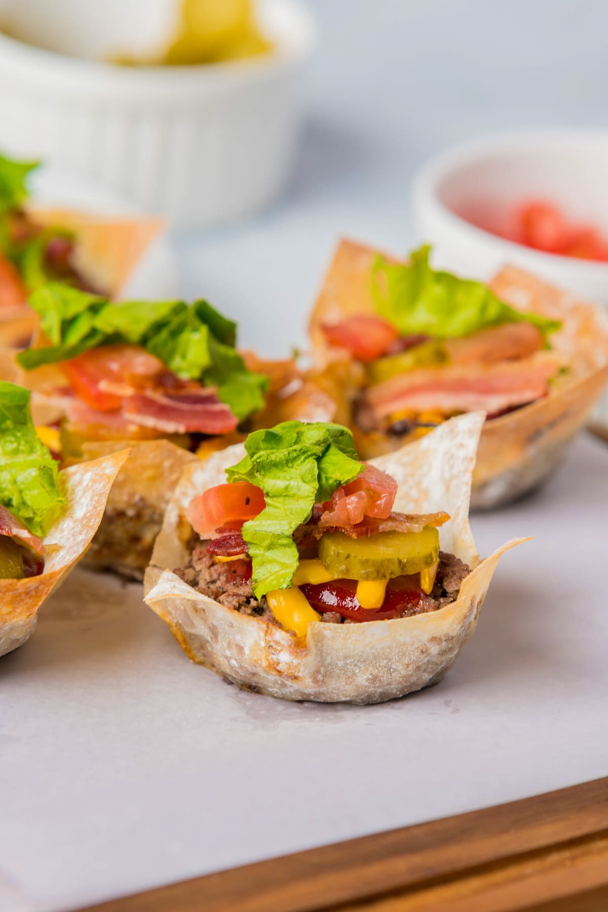 Cheeseburger cups on parchment paper