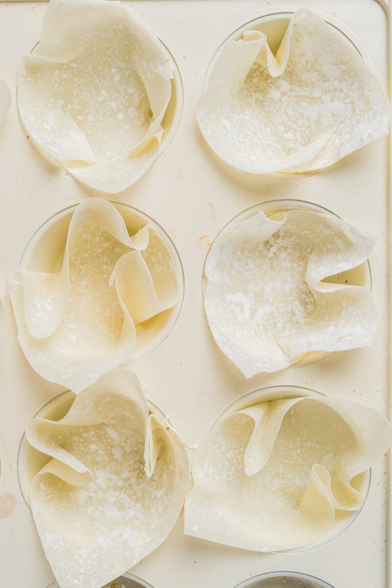 Wonton wrappers in muffin tin