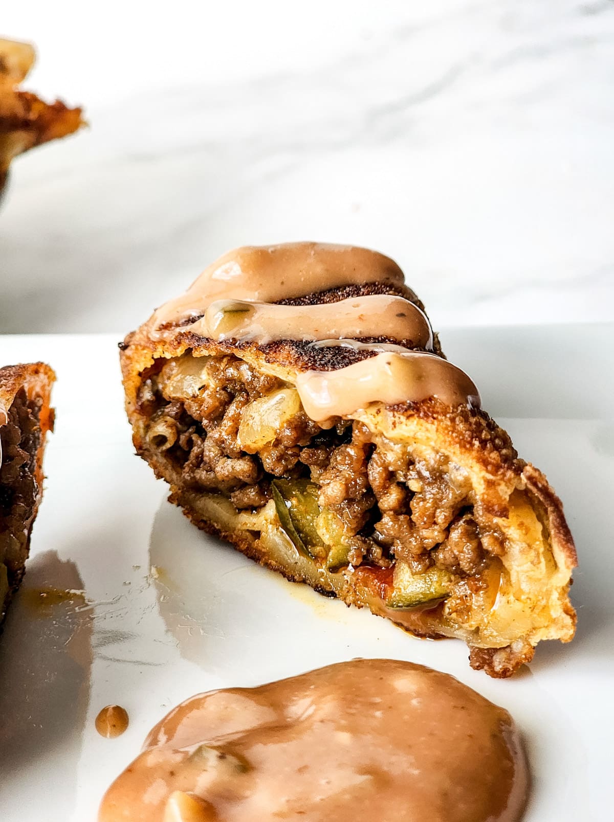 Cheeseburger egg roll with sauce