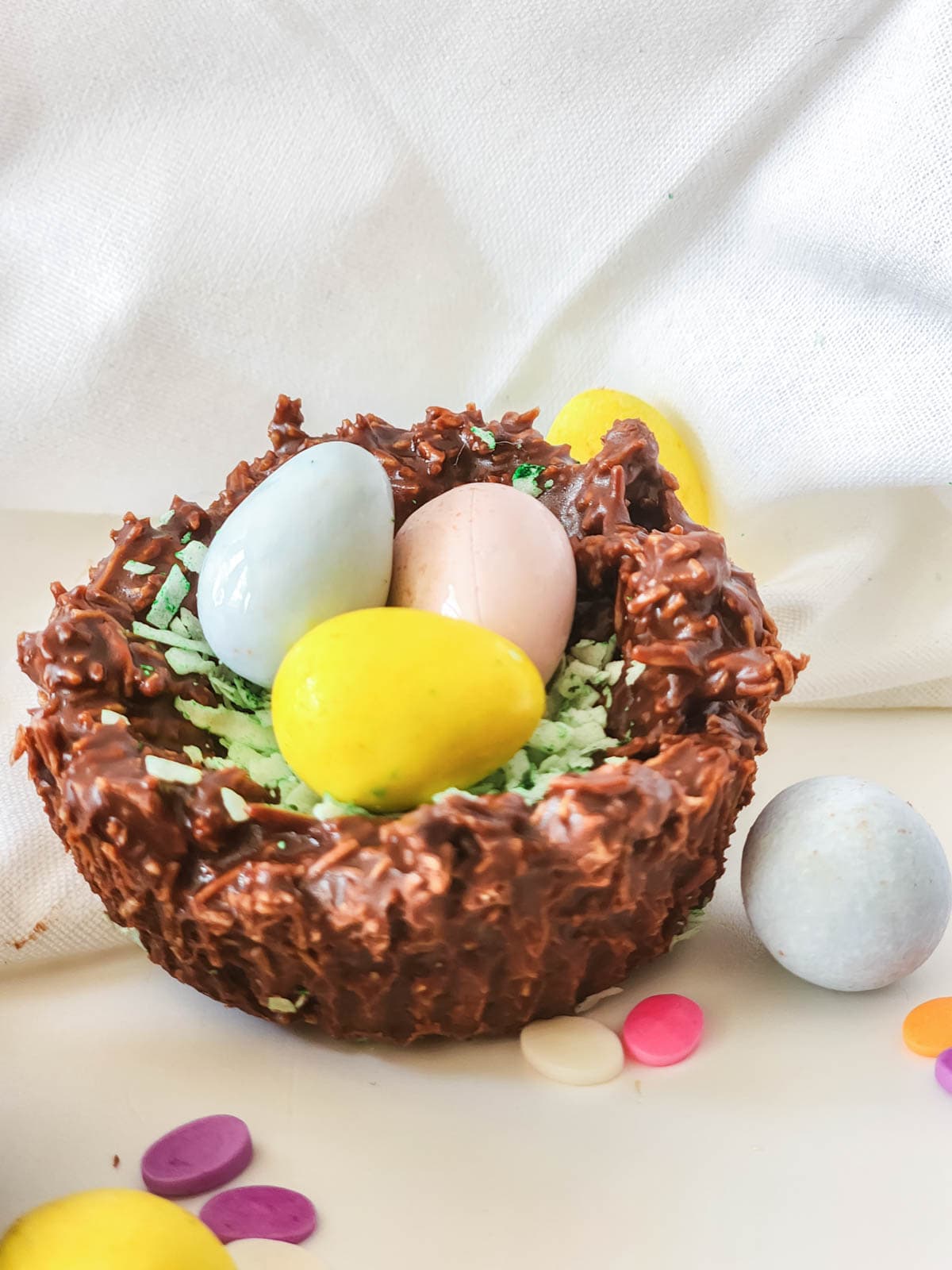 Easter egg nest with three eggs surrounded by sprinkles