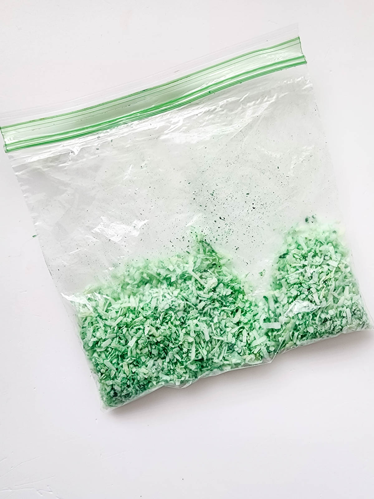 Coconut and green food coloring in bag
