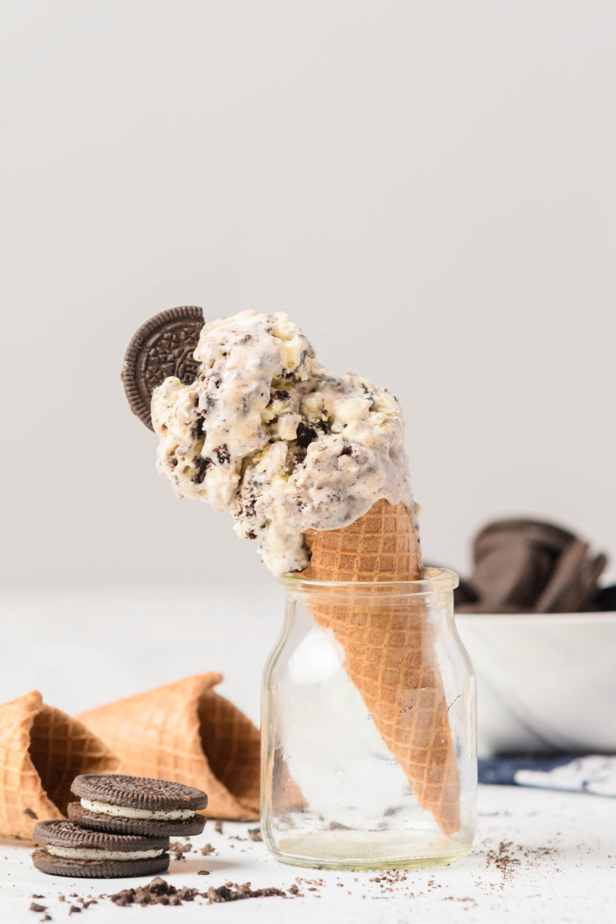 Oreo ice cream cone resting in glass