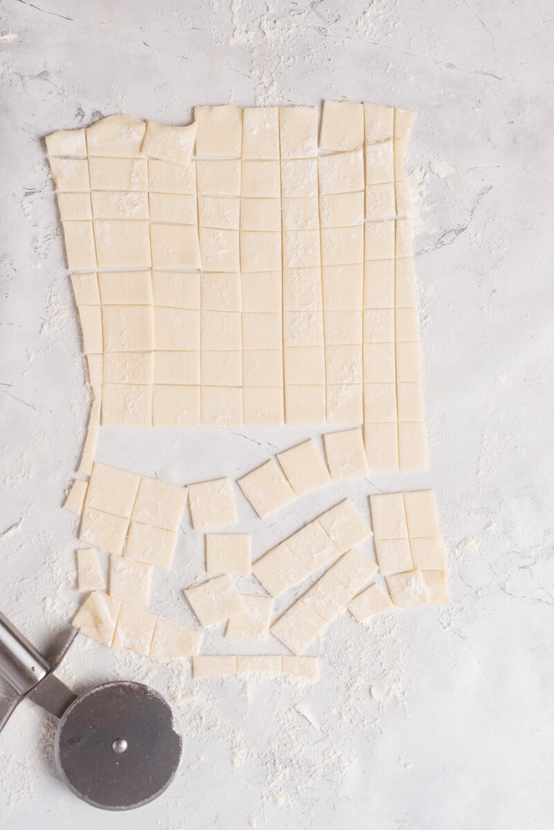 Crescent roll dough cut into squares