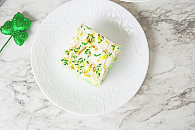 St. Patrick's Day Poke Cake on white plate