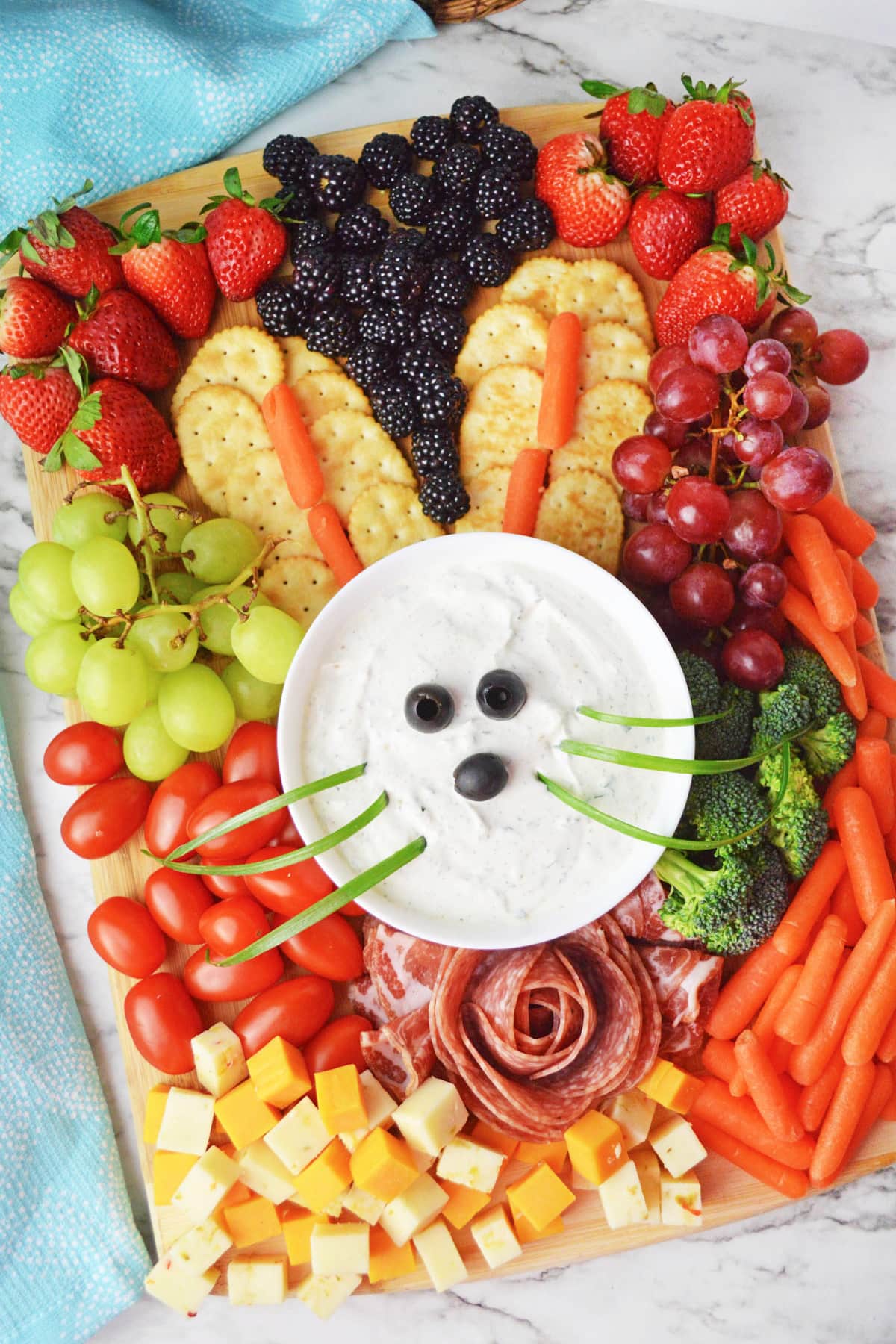 Bunny charcuterie board with veggie dip, fruits and vegetables