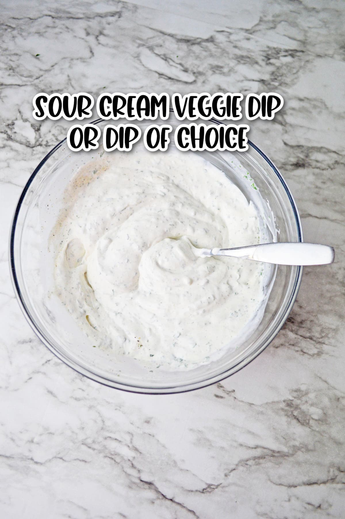 Sour Cream Veggie Dip in clear glass bowl