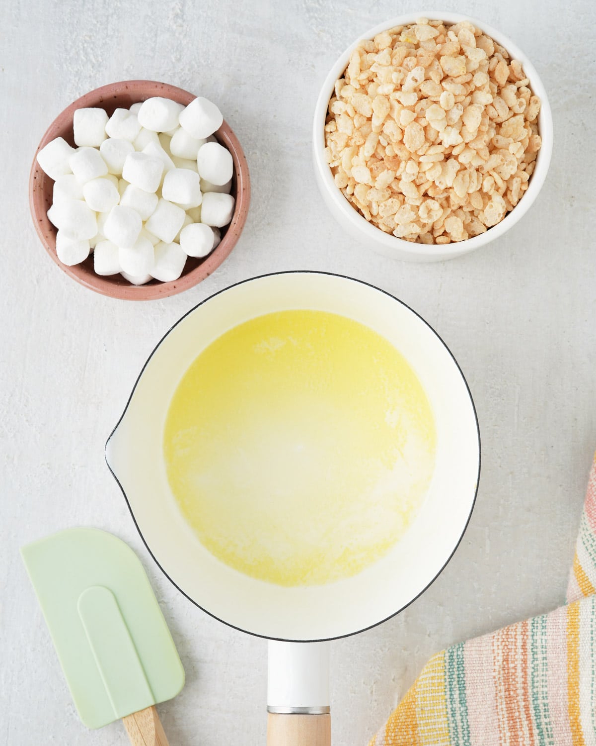 Melted butter, Rice Krispies and marshmallows