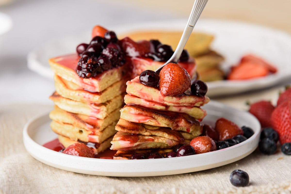 Fork with pancakes and berries
