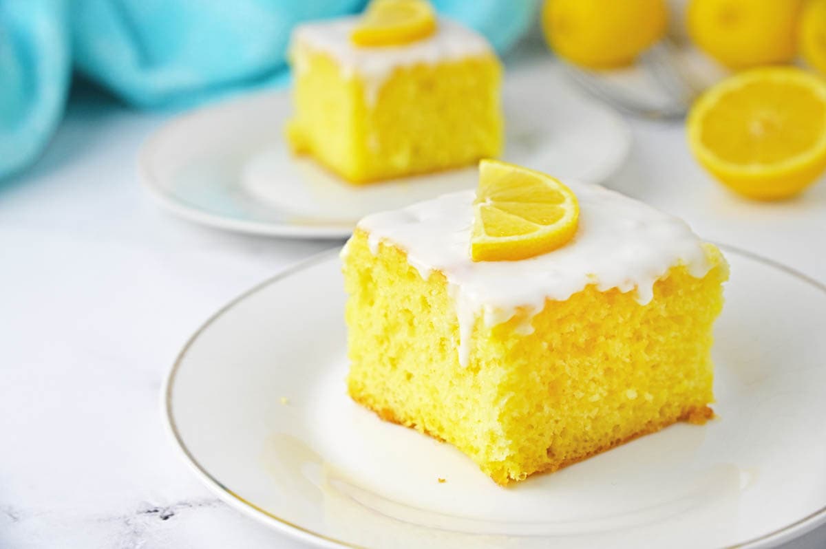 Lemon Jello Cake with icing drizzling down