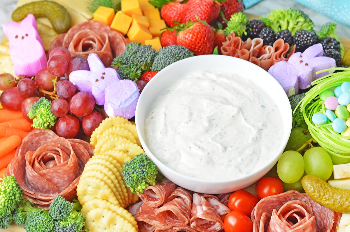 Sour cream dip with crackers, veggies and more