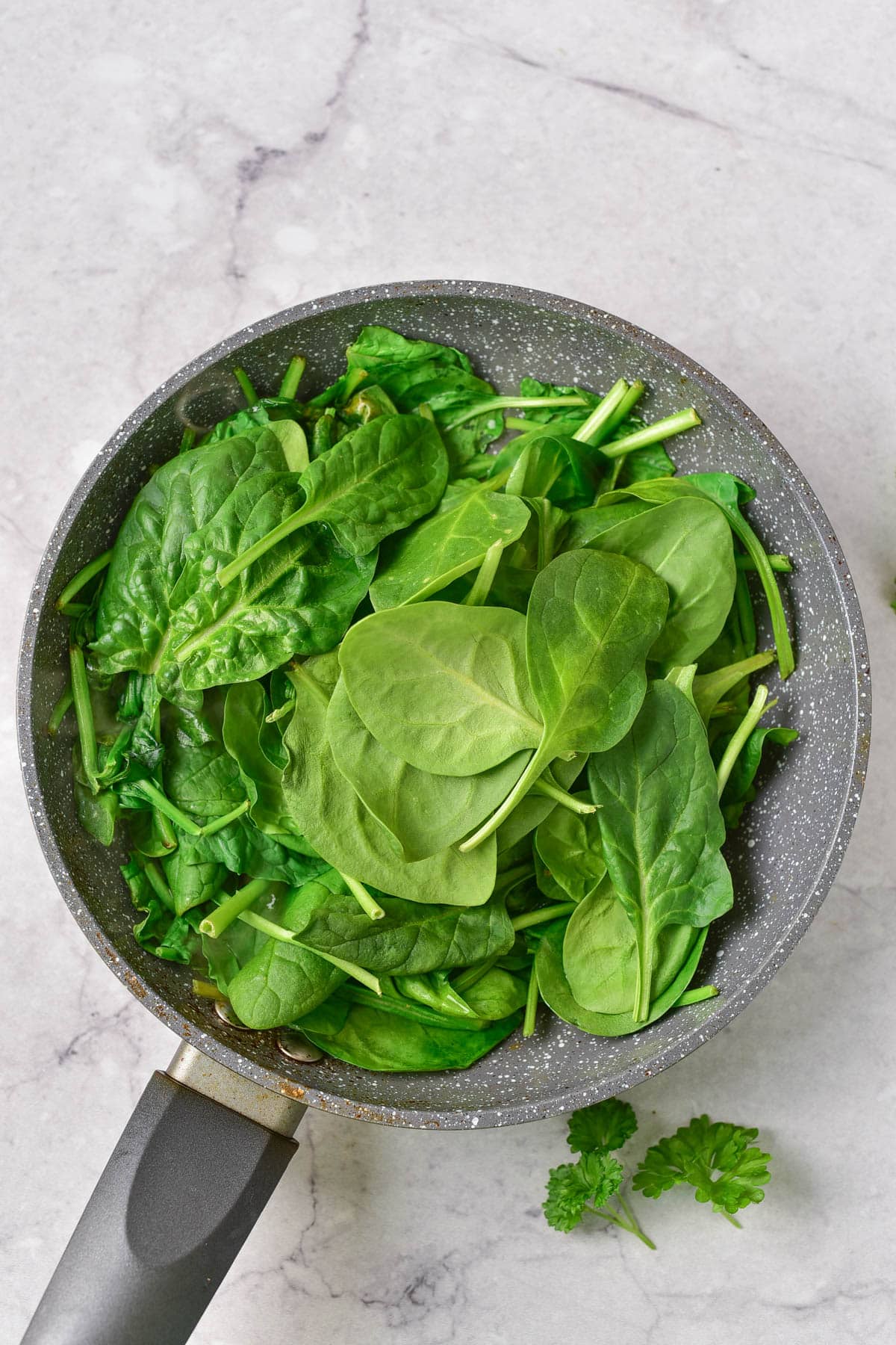 Spinach leaves in skillet