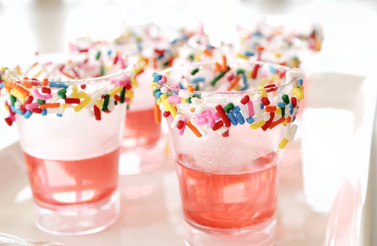 Pink jello added to shot glasses