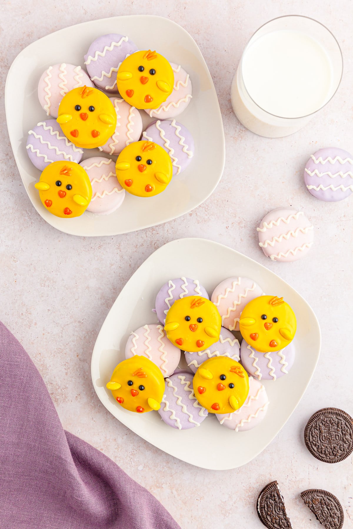 Easter Oreos on plates with milk and purple napkin