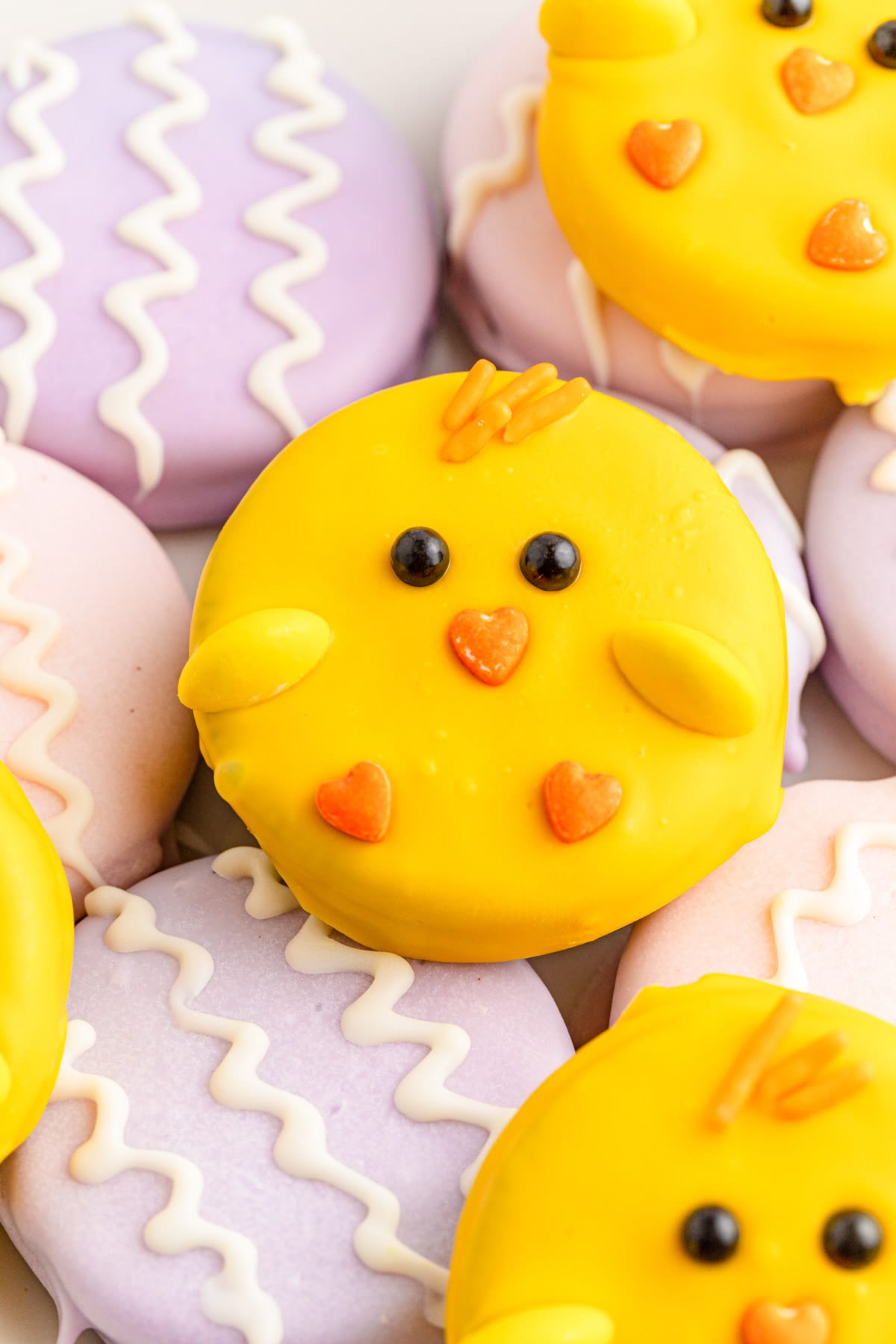 Oreos dipped colorful chocolate to make chicks and Easter eggs