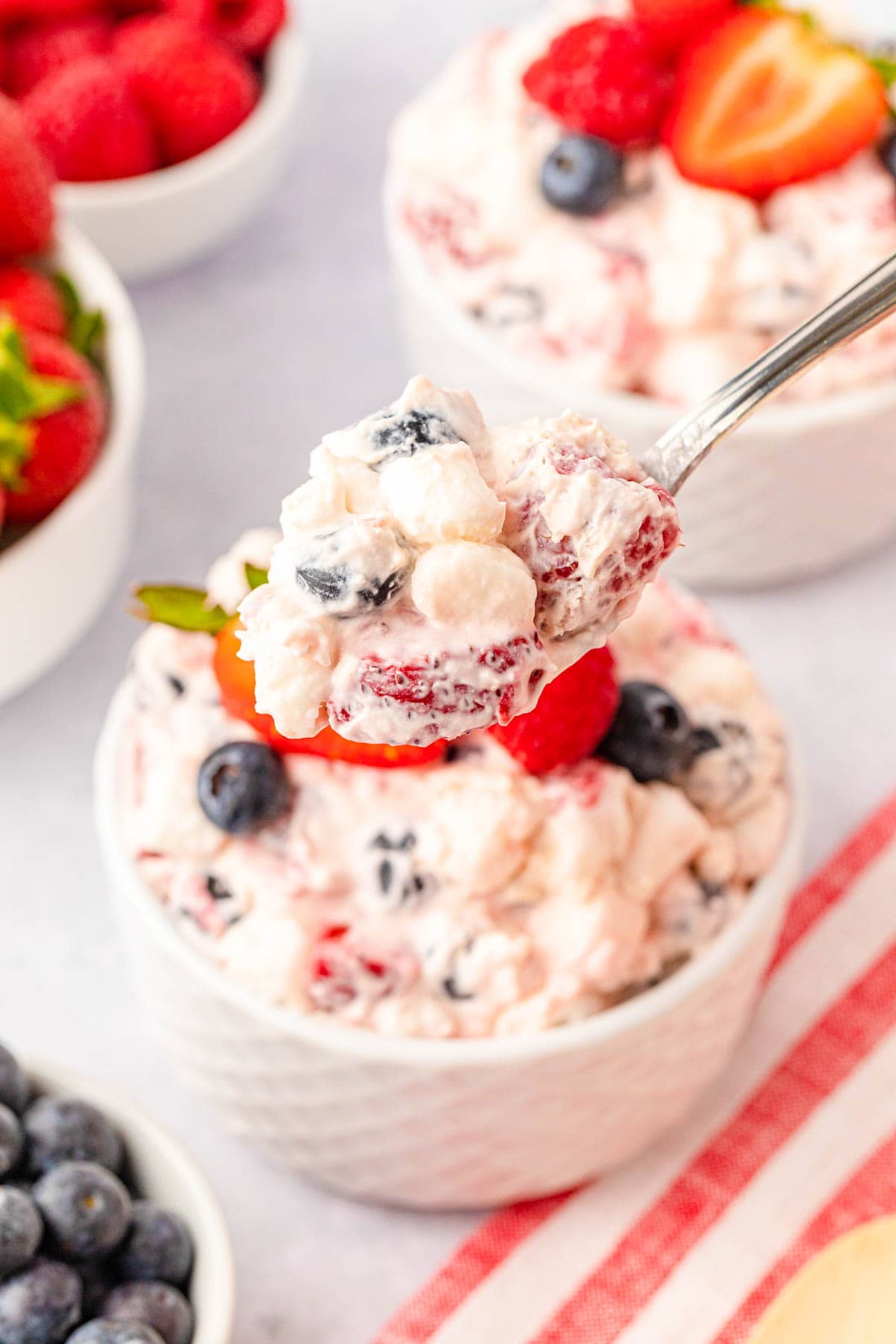 Mixed berry cheesecake fluff on spoon