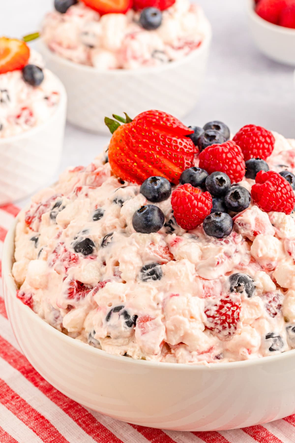 Berry fluff salad in white bowl