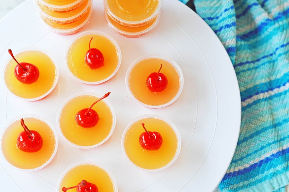 Jello shots on white plate from above