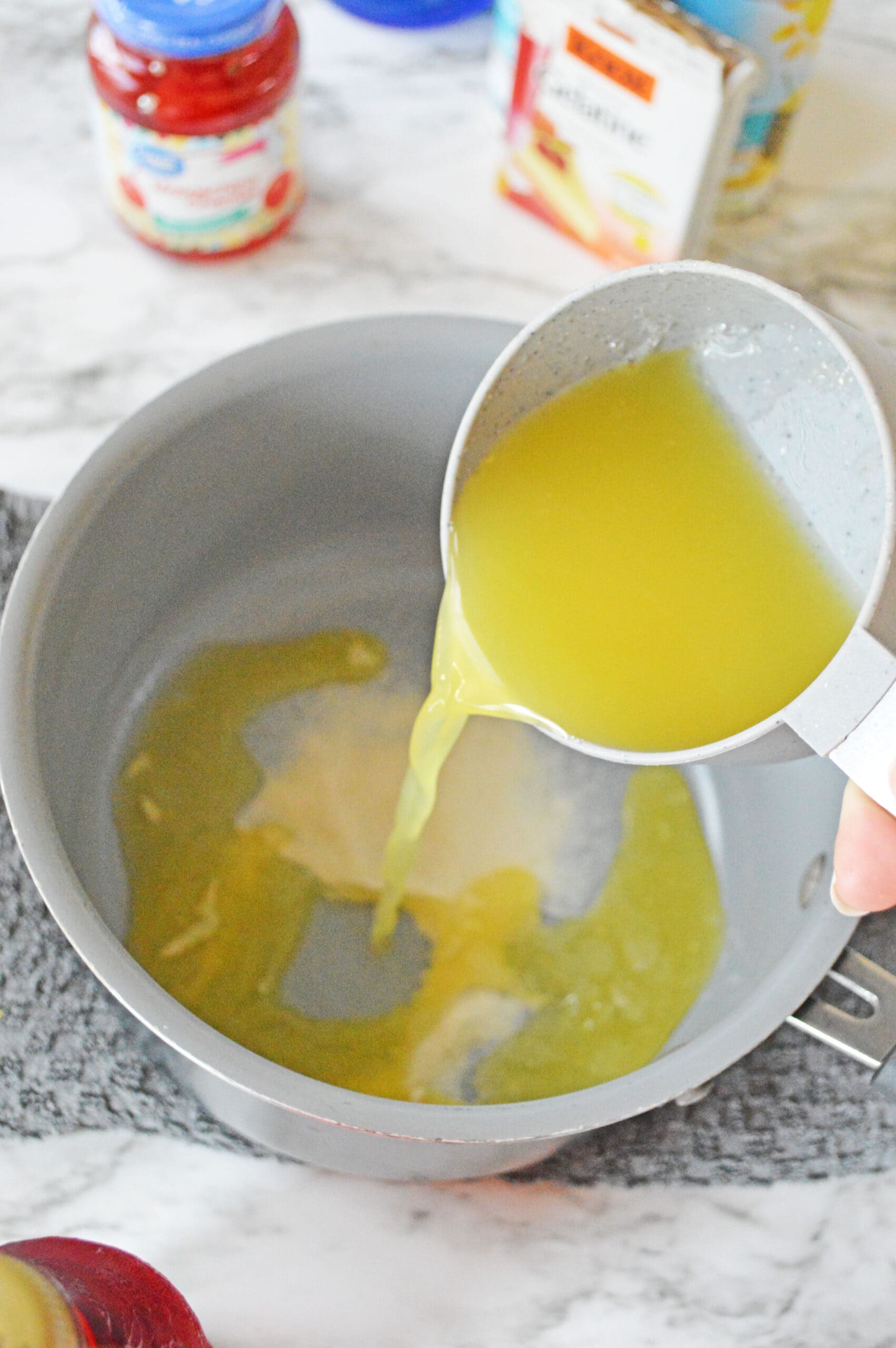 Adding pineapple juice to saucepan