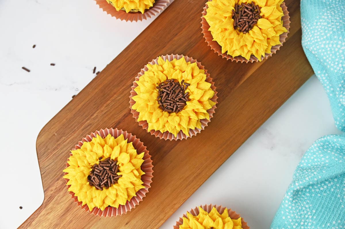 Cupcakes on wooden cutting board