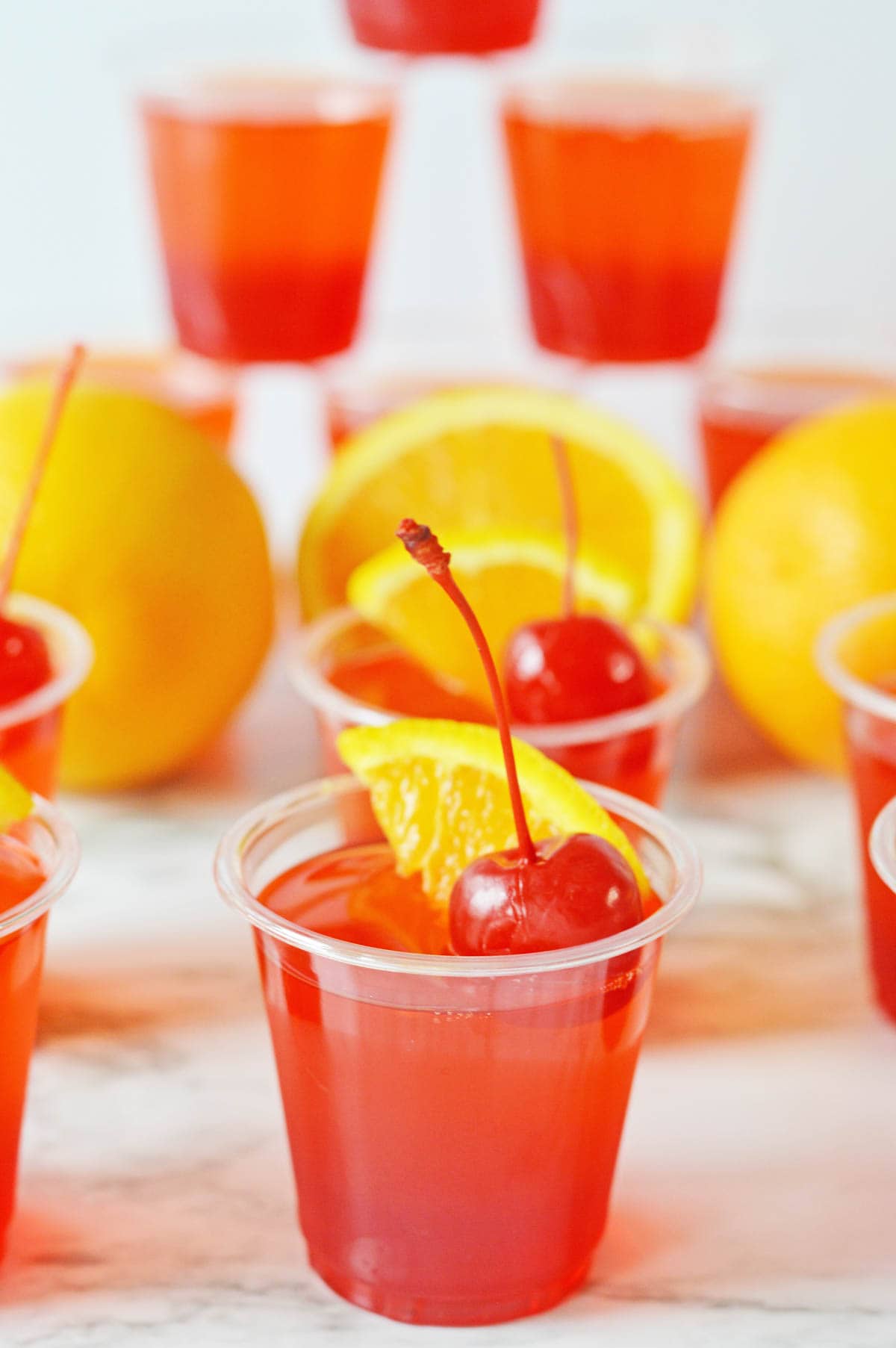 Jello shots with cherries and oranges