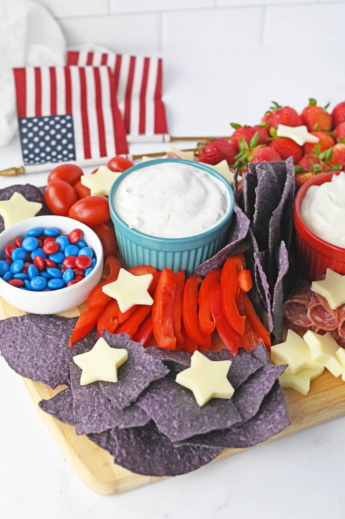 Charcuterie board with red, white and blue food