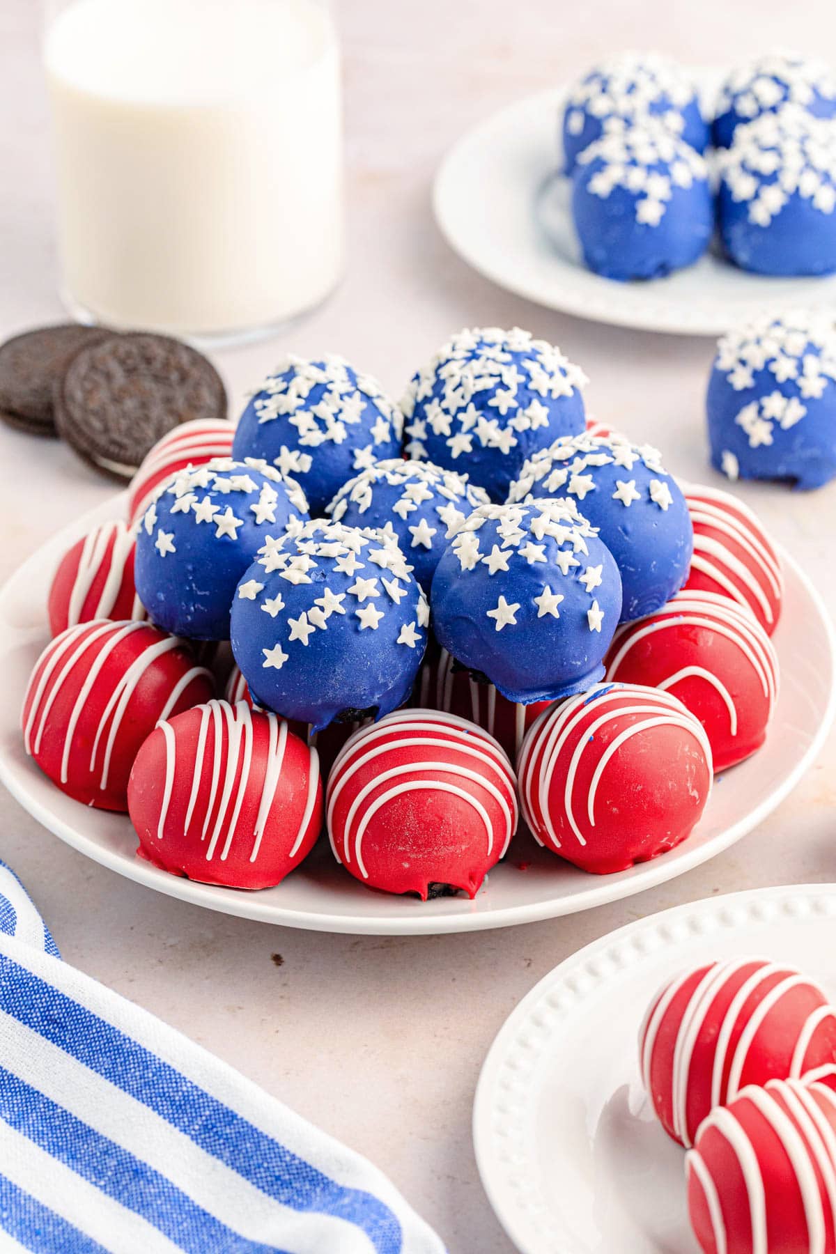 Red and blue cake balls piled on a white plate