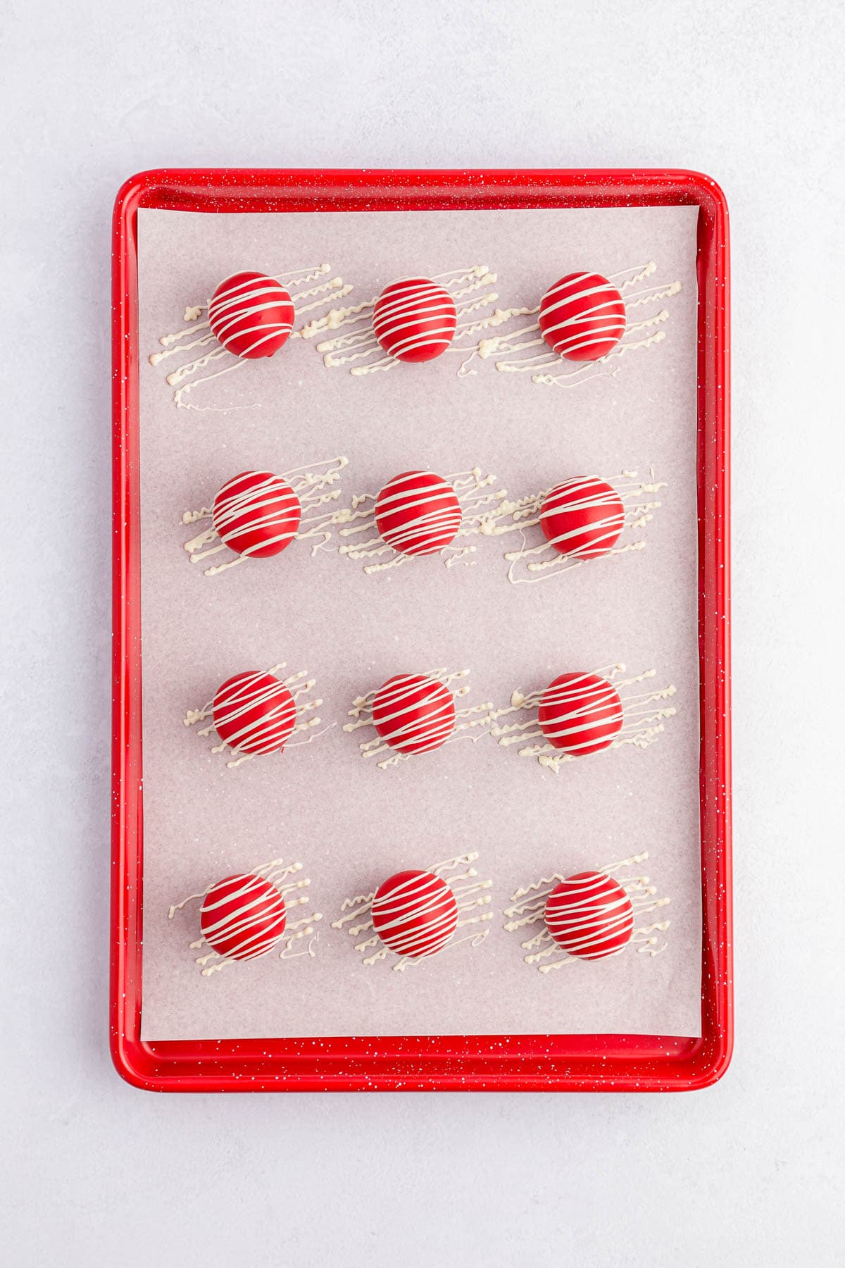 Red Oreo balls drizzled with white chocolate