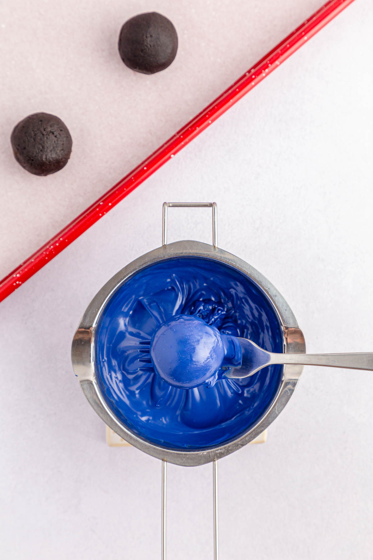 Oreo ball dipped in melted blue chocolate
