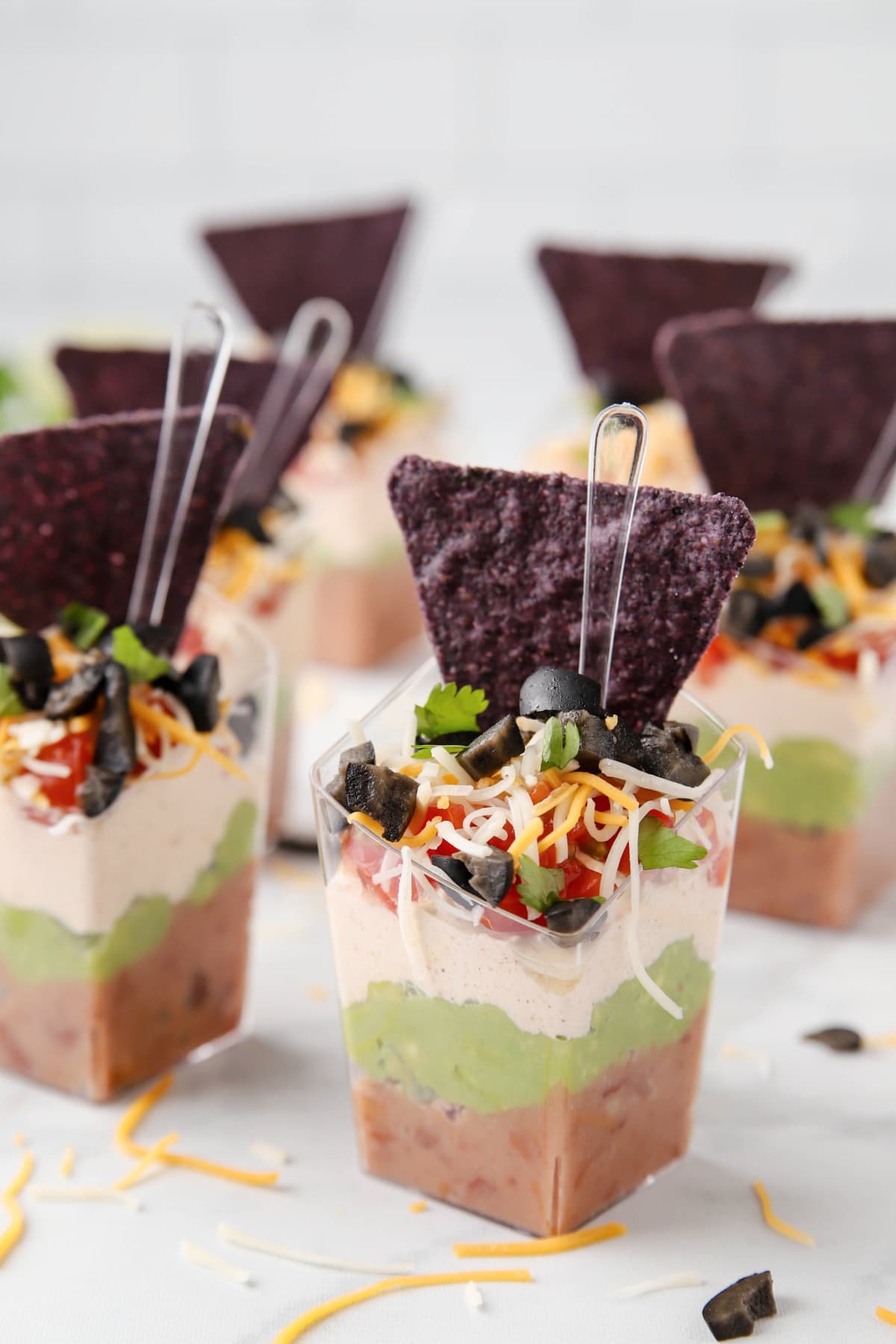 7 Layer dip cups on white counter