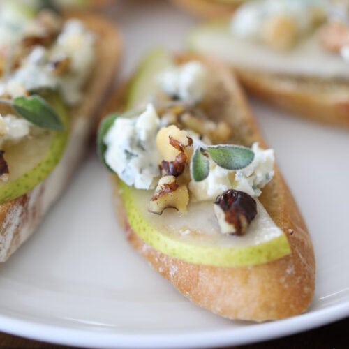 Crostini appetizer with blue cheese, pear and honey