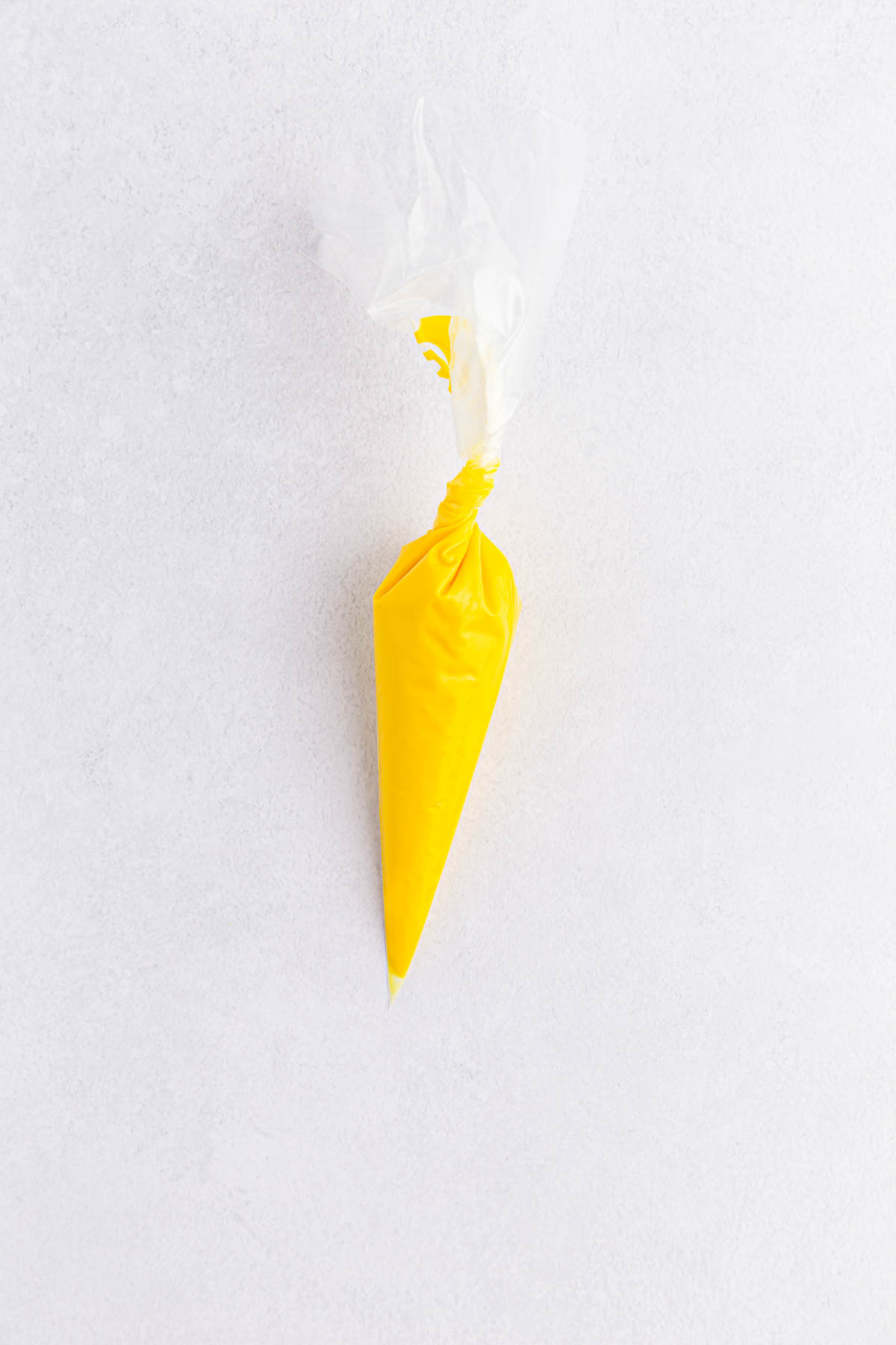 Yellow candy melts in piping bag