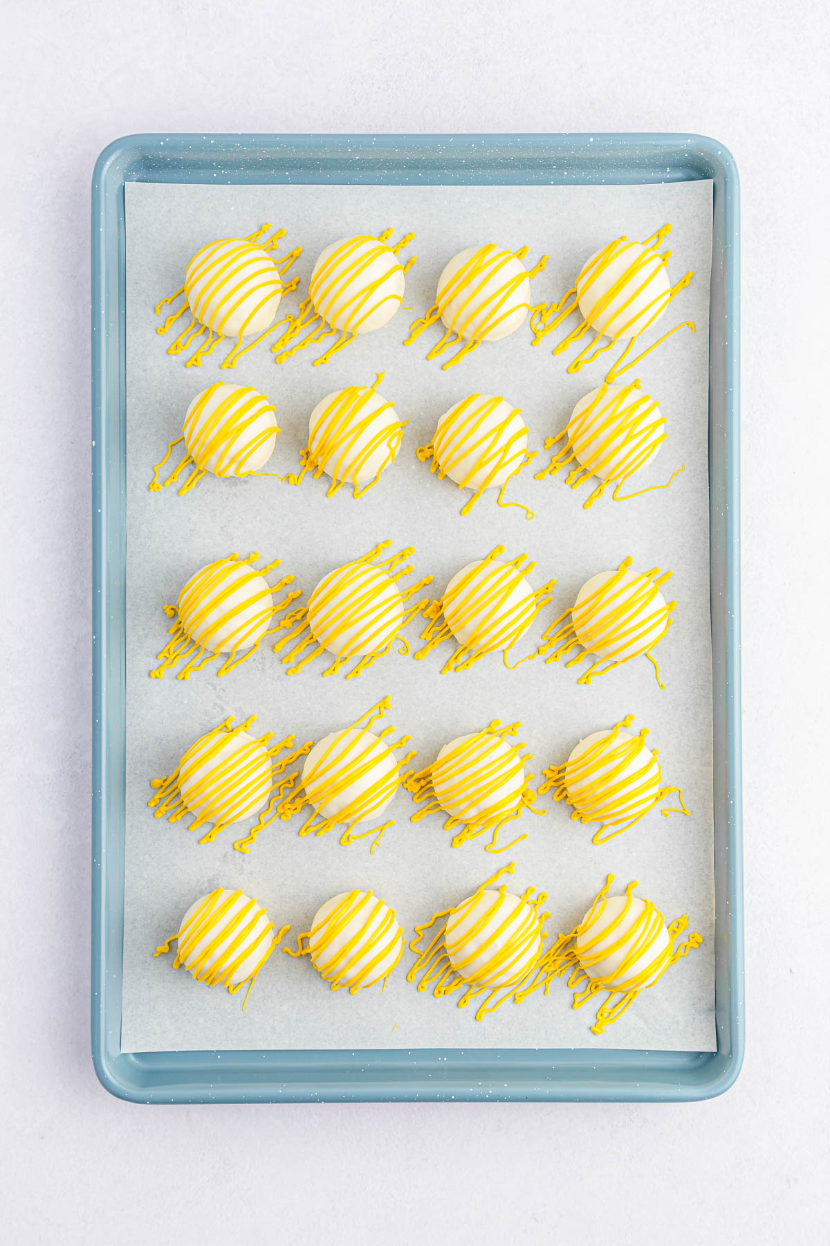 Lemon cake balls with yellow drizzle