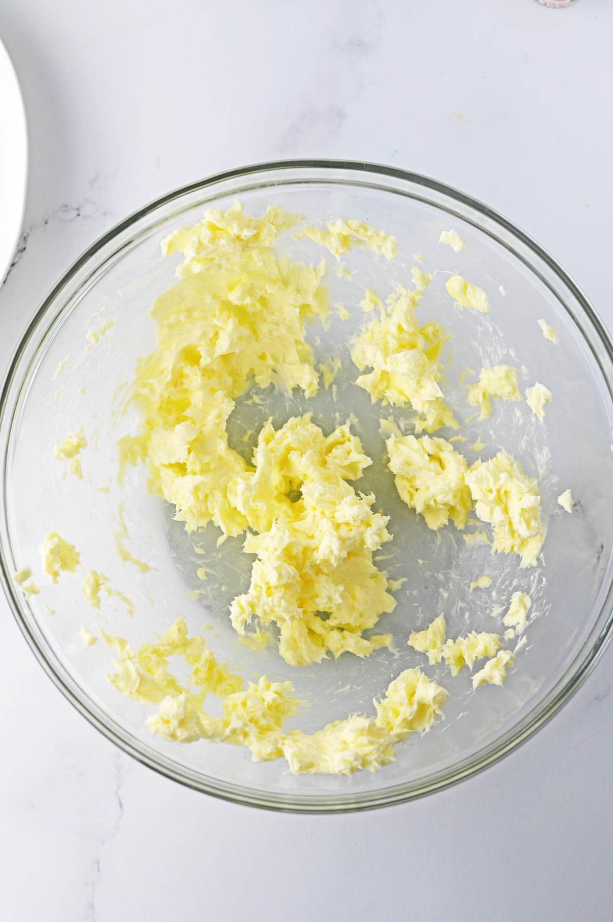 Butter creamed in a clear glass bowl