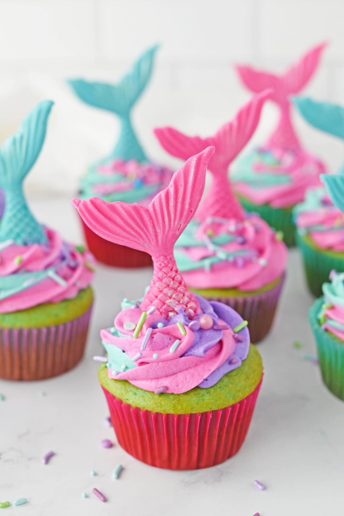 Mermaid cupcakes on white marble counter