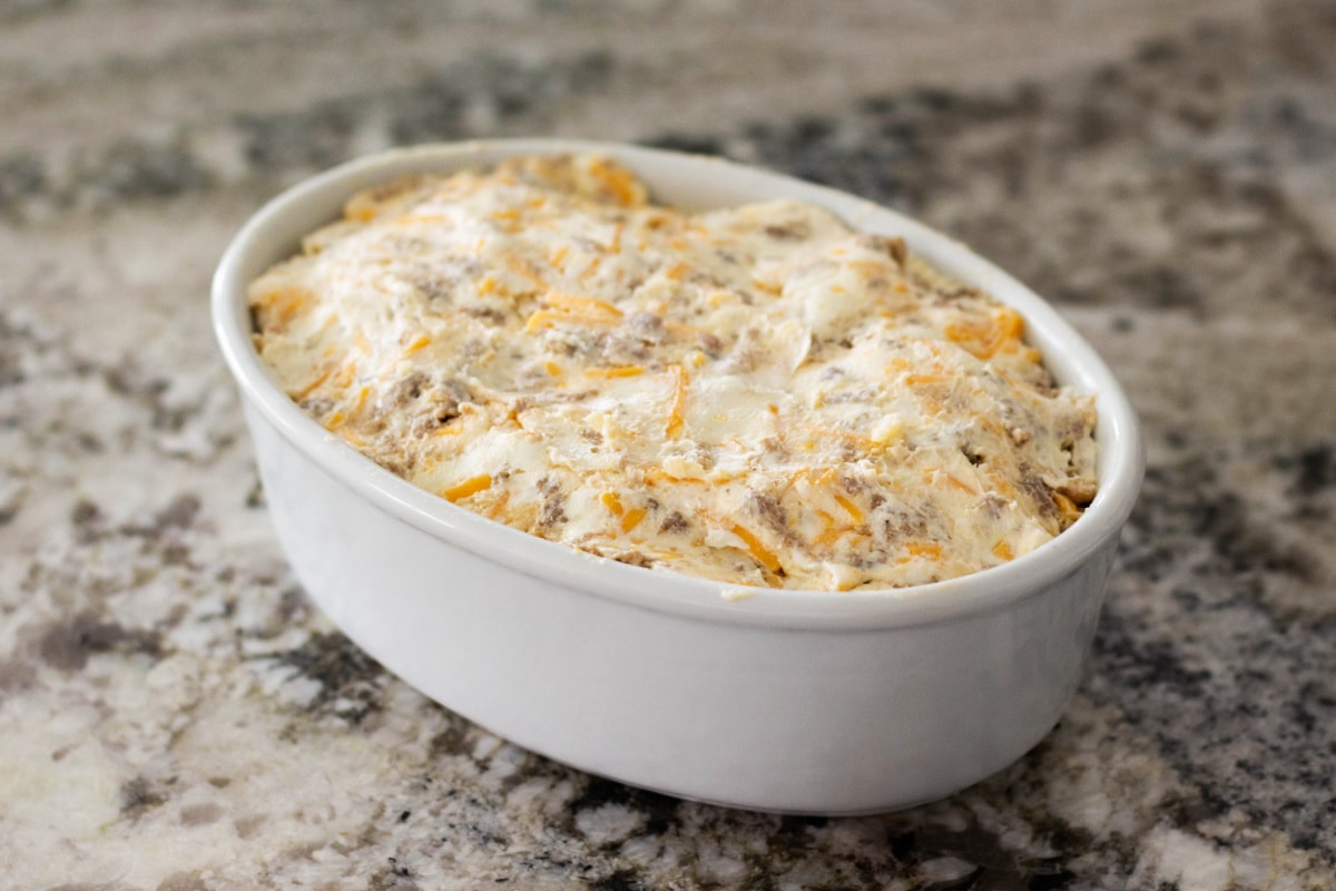 Sausage cheese dip uncooked in baking dish