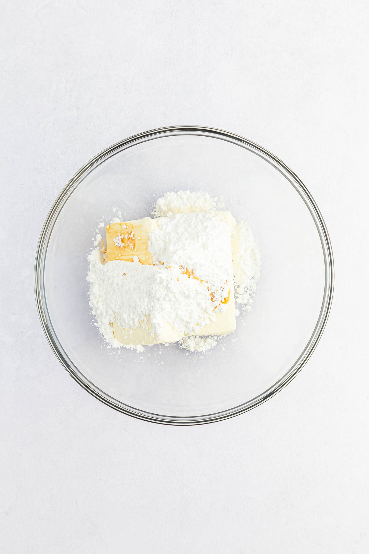 Cream cheese, powdered sugar and vanilla in bowl