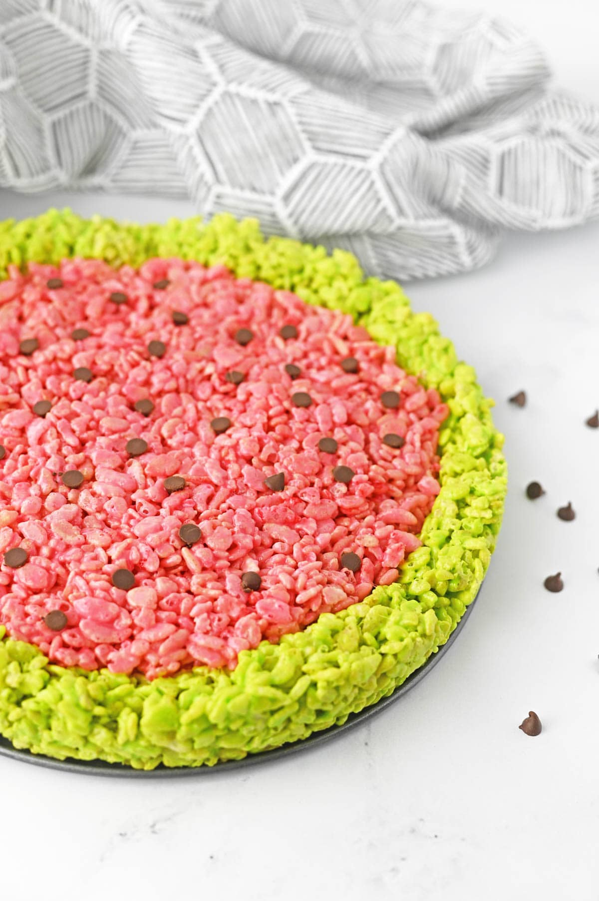 Watermelon rice krispie treat with gray and white patterned napkin