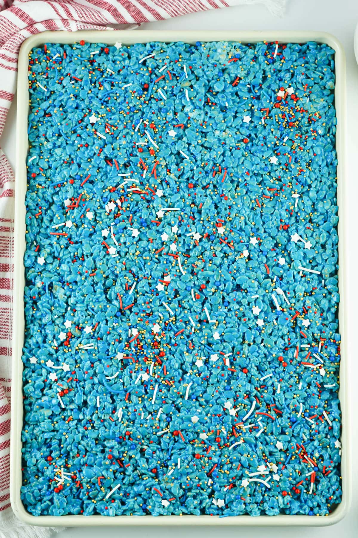 Patriotic sprinkles added to red white and blue krispie treats