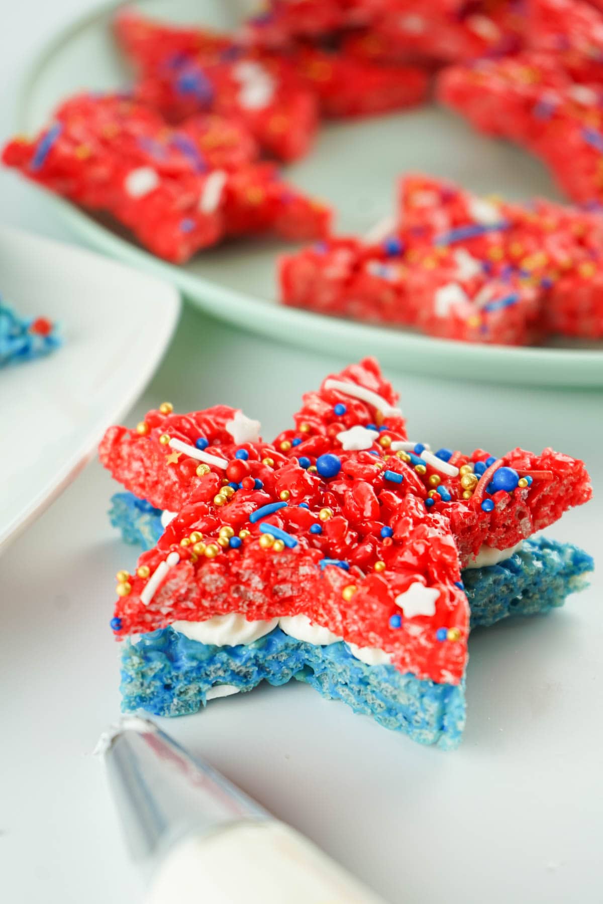 Blue and red krispie treats with icing in between
