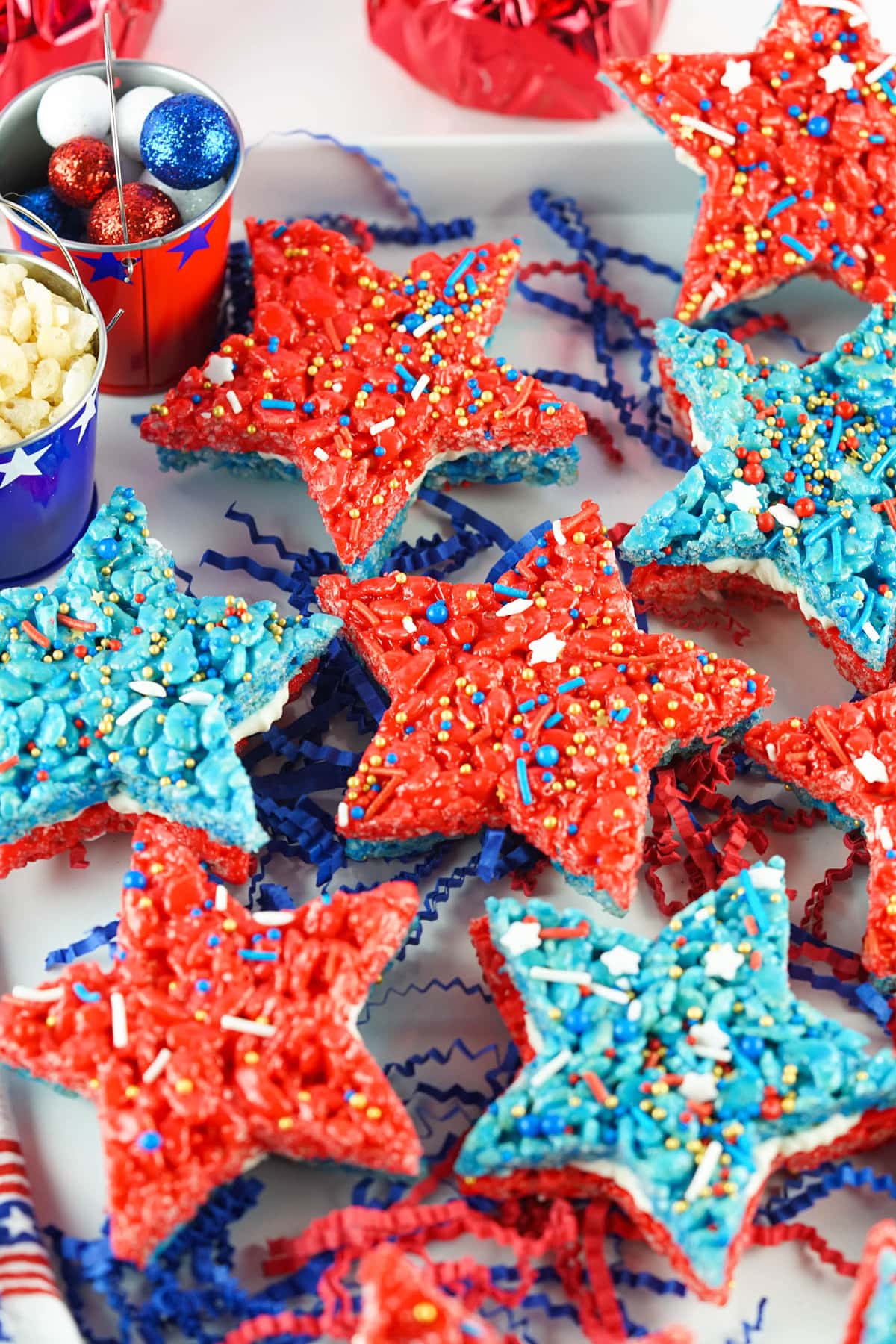4th of July Rice Krispie treats with red and blue paper accents underneath