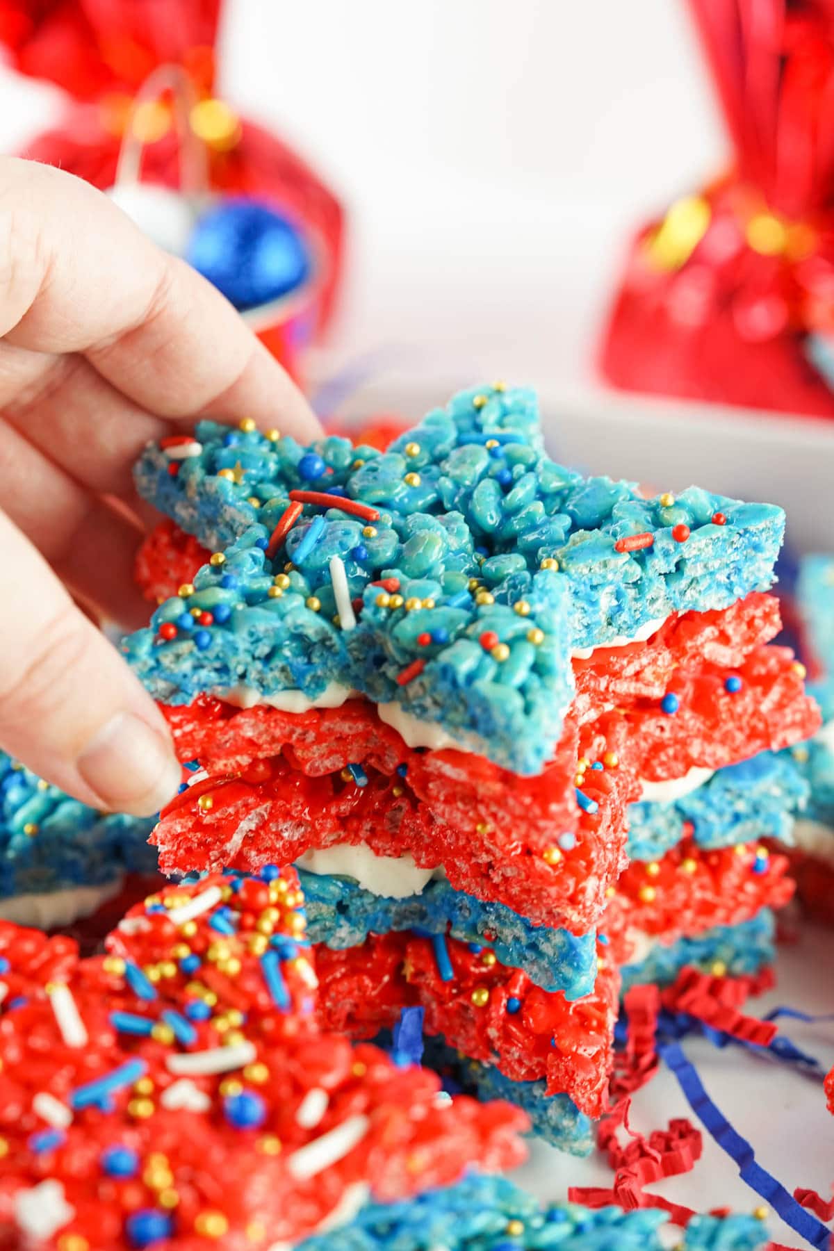 Hand picking up a 4th of July Rice Krispie treat