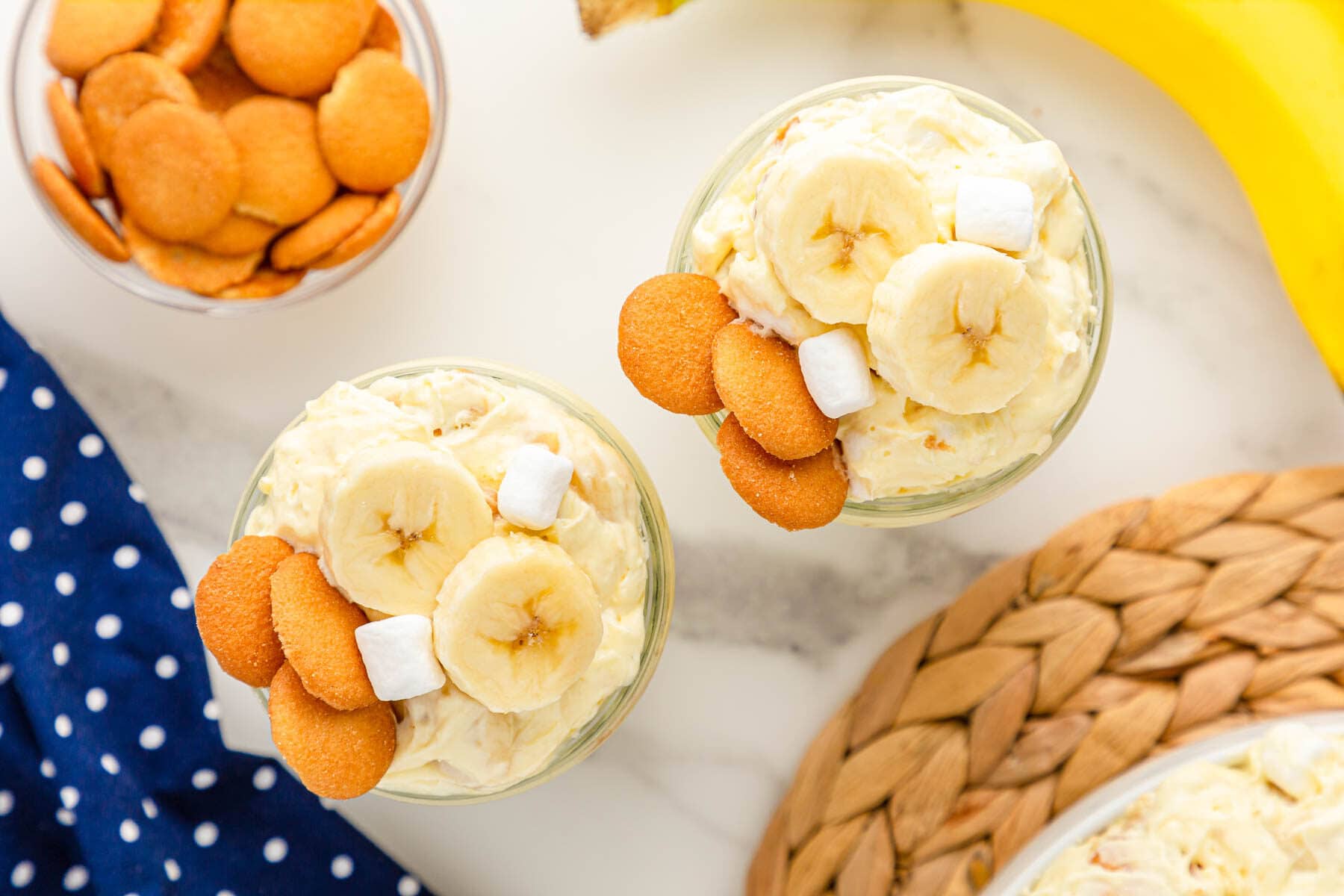 Banana pudding fluff in two jars on marble counter