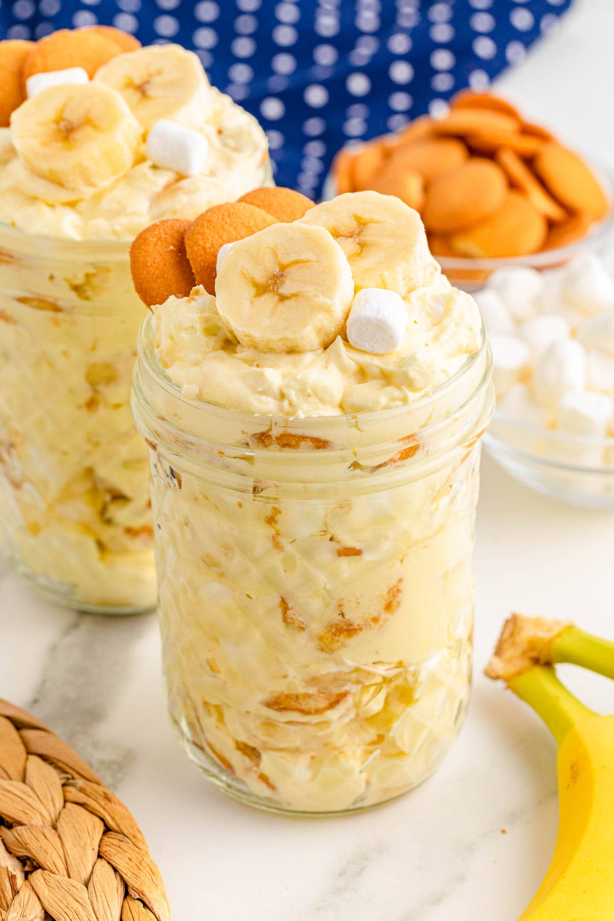 Banana pudding fluff in glass jar on white marble countertop