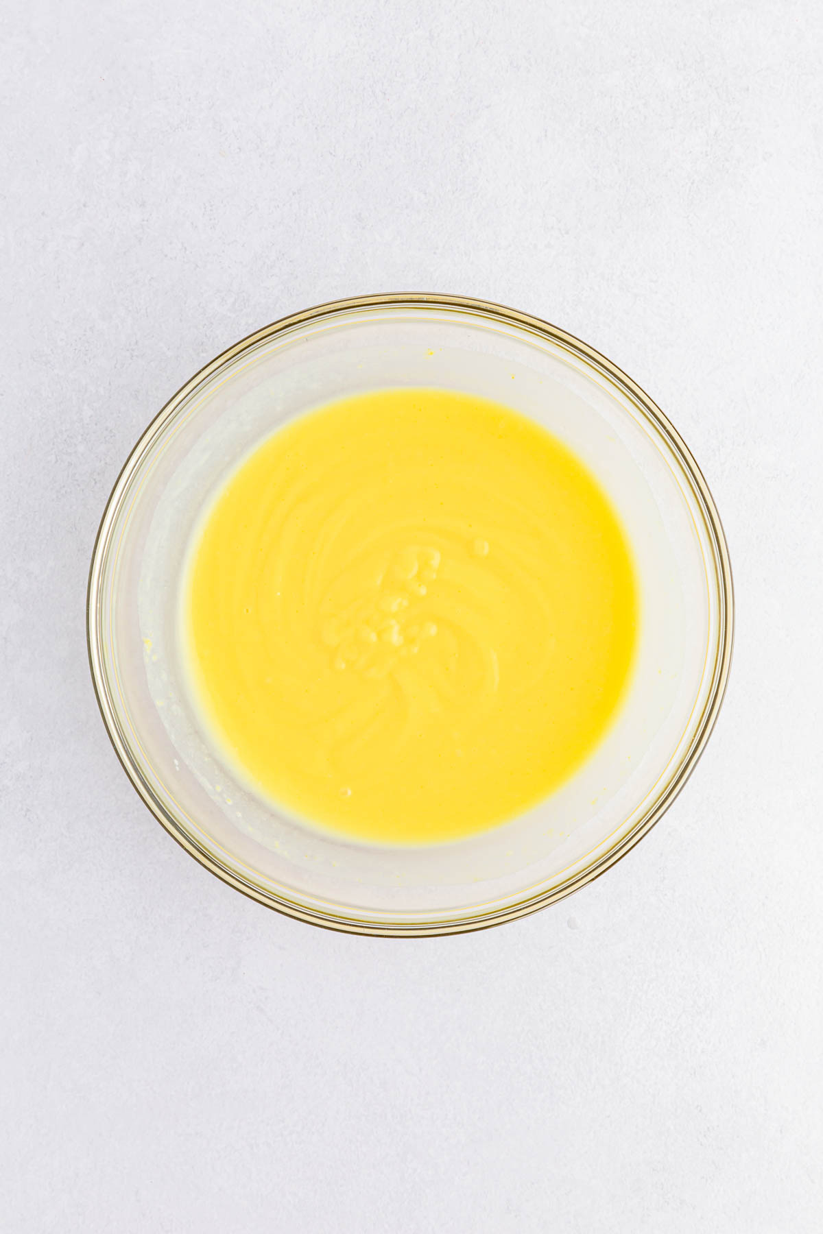 Vanilla pudding in clear glass bowl