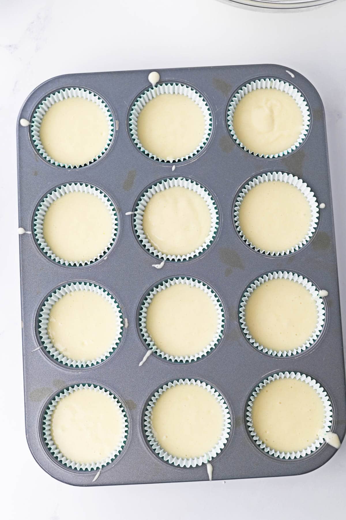 Cupcake liners filled with batter